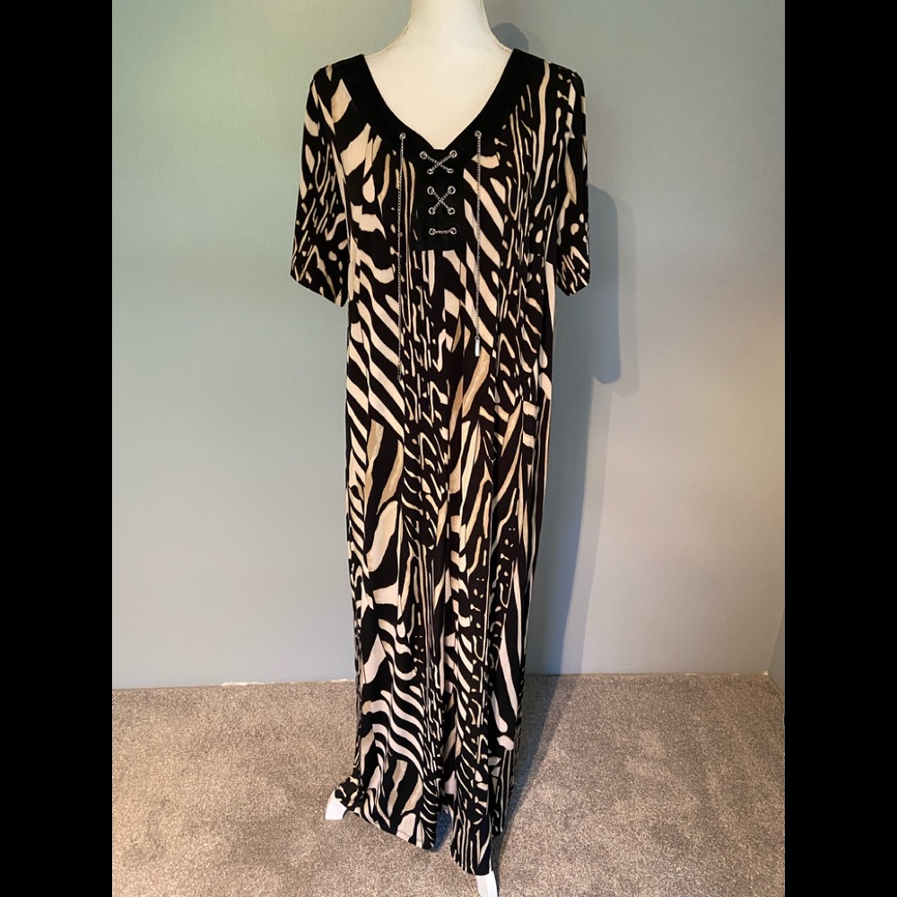 Catherine’s animal print dress with chain front detail